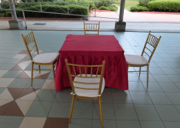 Red cloth square table paired with tiffany chairs