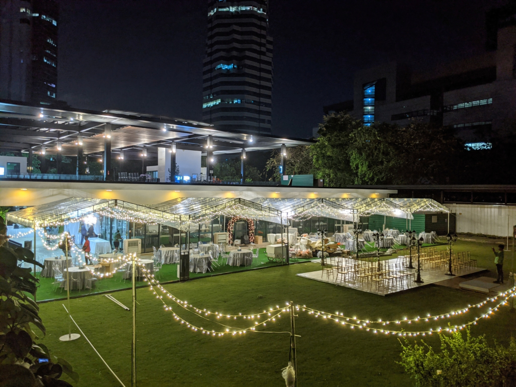 A-Shaped Tent Wedding with Fairy Lights and Floral Arch